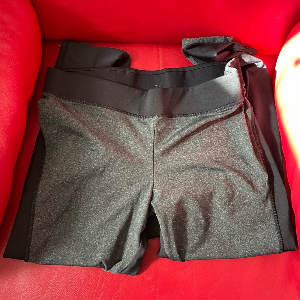 Grey and black leggings with mesh cutouts